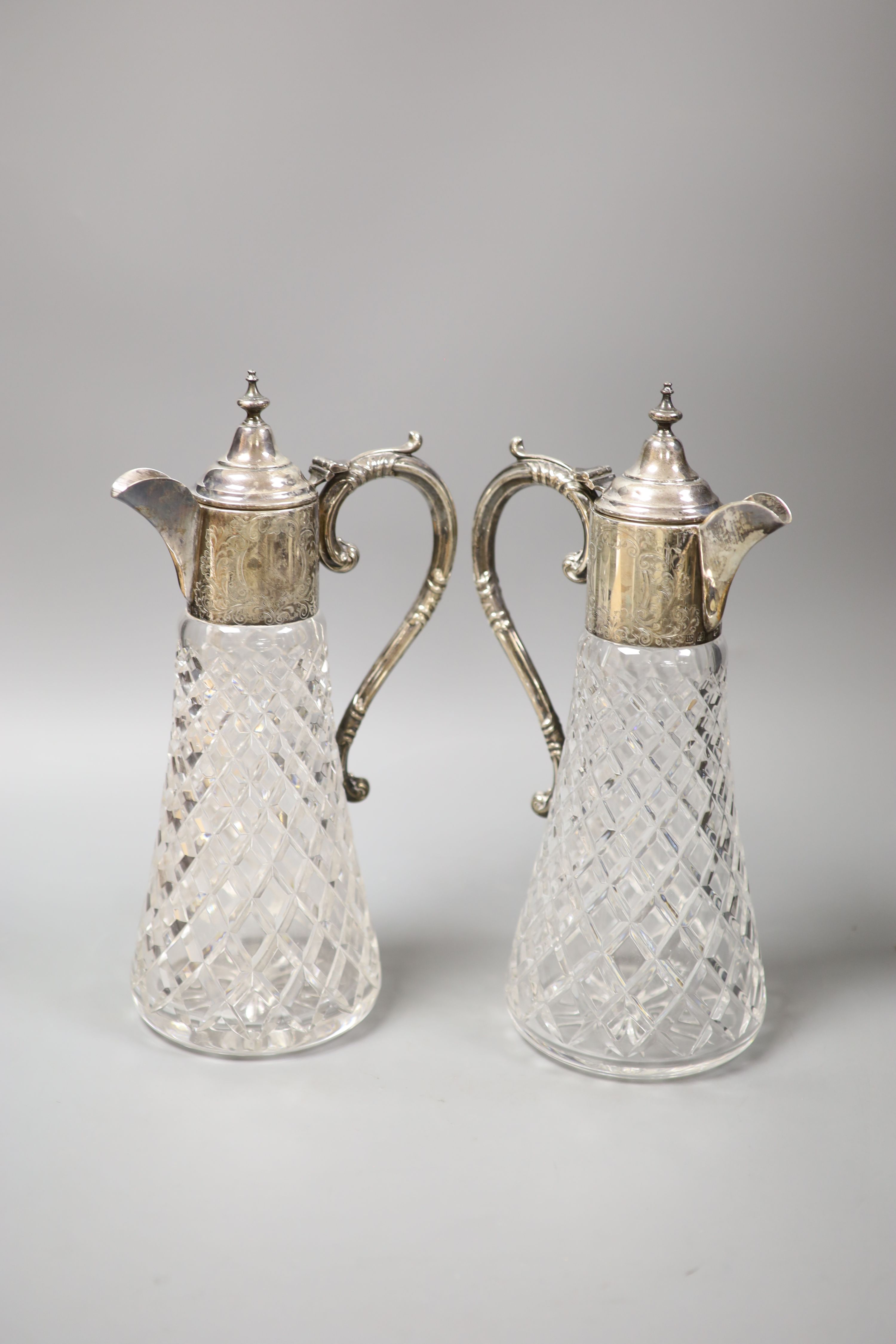 A pair of modern silver mounted cut glass claret jugs, Birmingham, 1972/74, height 32.3cm.